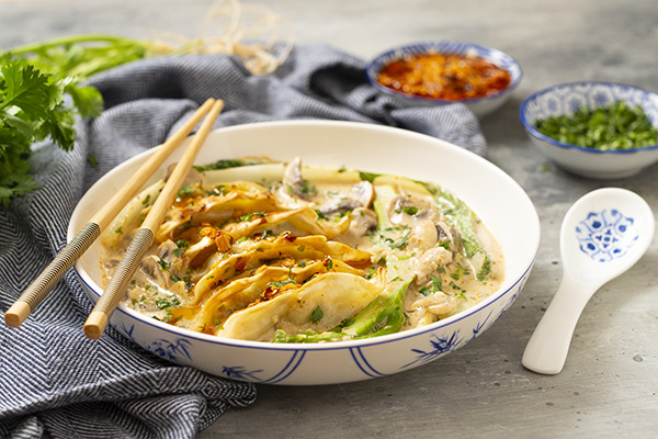 Coconut Curry Prawn Dumpling Bake with Krunchilli Oil and Coriander