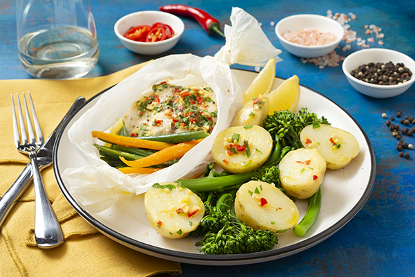 Fish en Papillote With Lemon Herb Butter Broccolini and Chat Potatoes