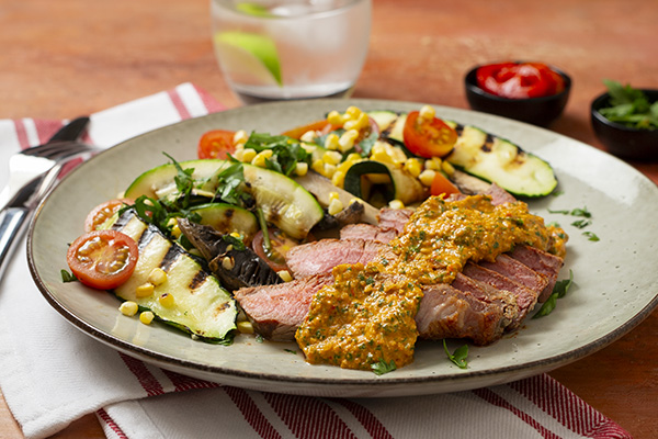 Grilled Steak with Romesco Sauce, Zucchini and a Corn Salad