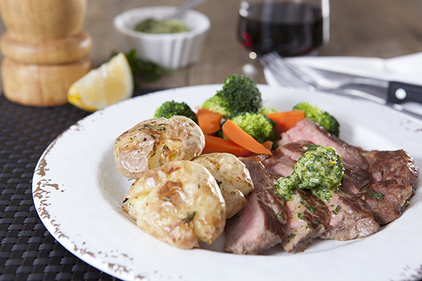 Steak with Garlic and Herb Butter, Crispy Smashed Potatoes and Steamed Vegetables