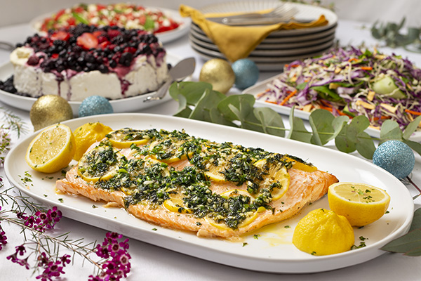 Whole Side of Salmon Covered in a Citrus & Herb Infused Butter Sauce