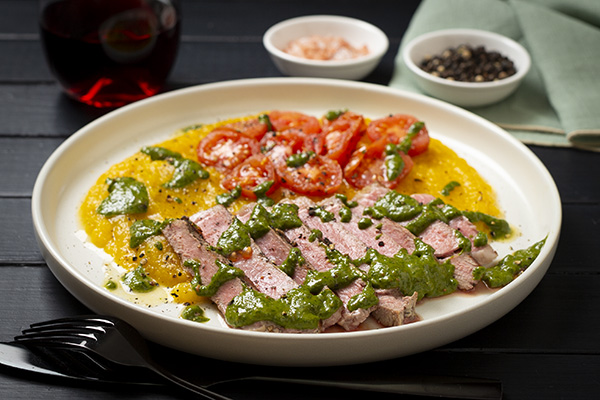 Porterhouse Steak with Spinach Chimichurri Sweet Potato Mash and Charred Cherry Tomatoes