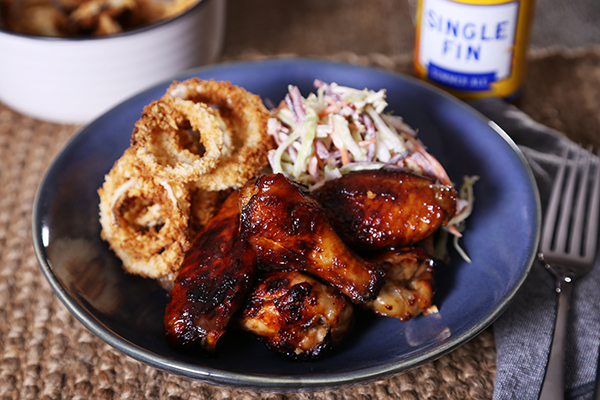 Sticky Vegemite Chicken Wings with Oven Baked Onion Rings and Slaw