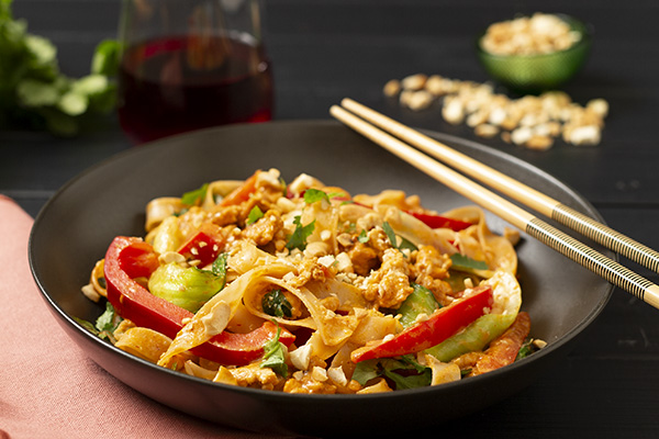 Coconut Red Curry Chicken and Noodles with Crunchy Peanuts and Lime